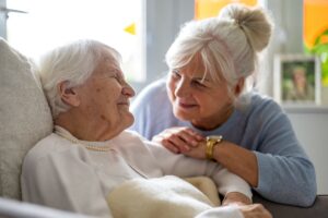 The Gardens of Amarillo | Smiling senior talking with family member